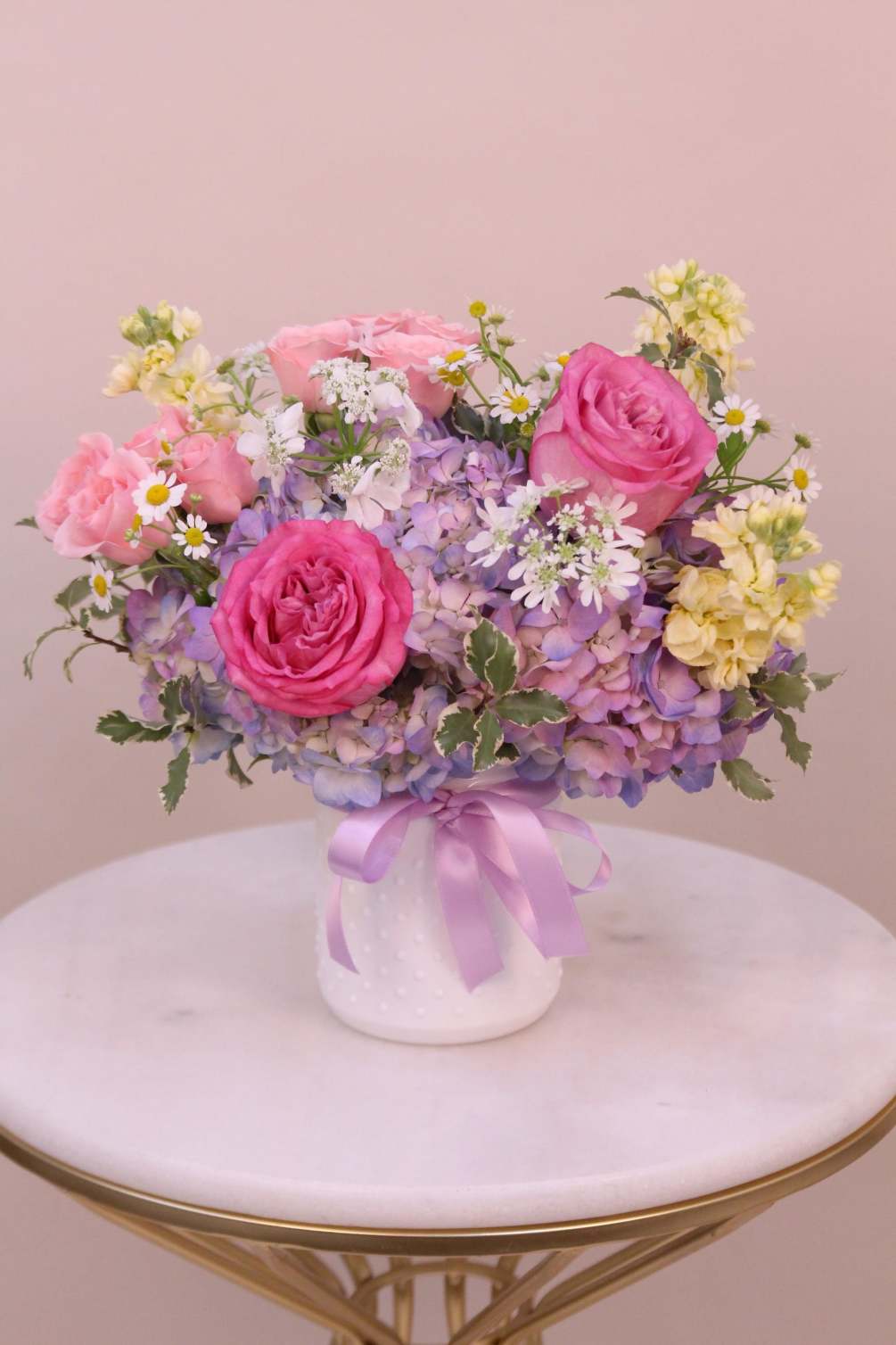 This beautiful arrangement of pastel flowers will surely delight your recipient. Flowers