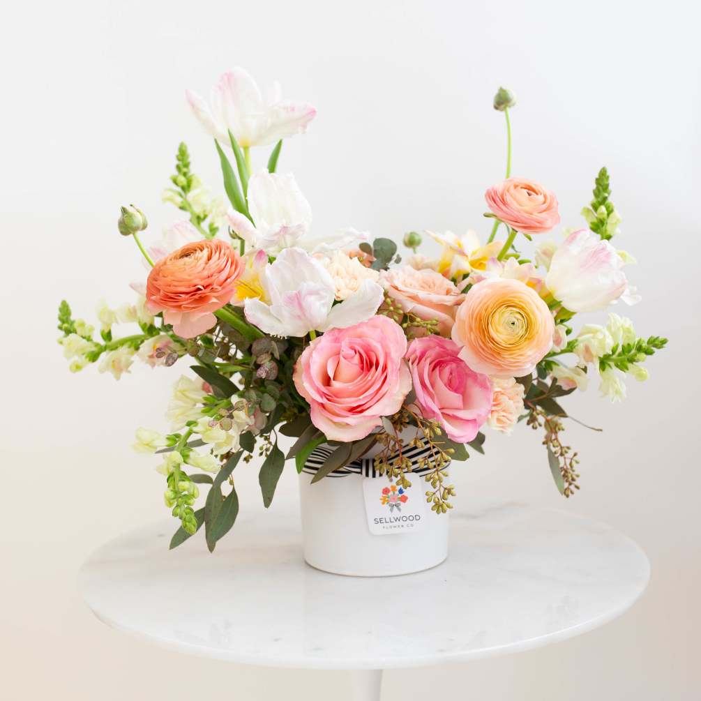 Let the pinks and peaches of this bespoke bouquet show your loved