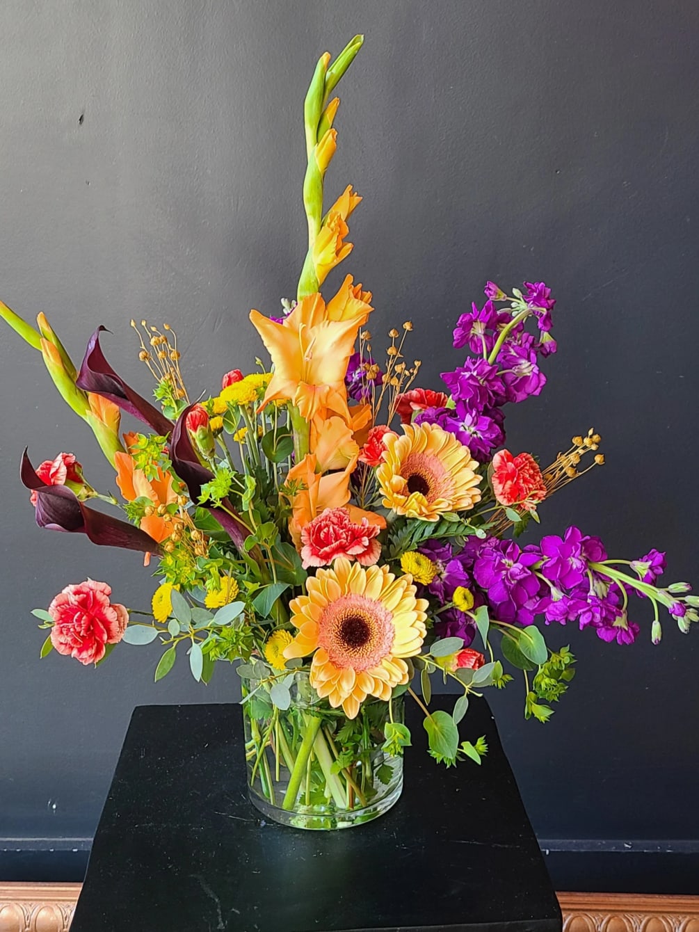 Knock their socks off with this colorful and creative arrangement of gerbs