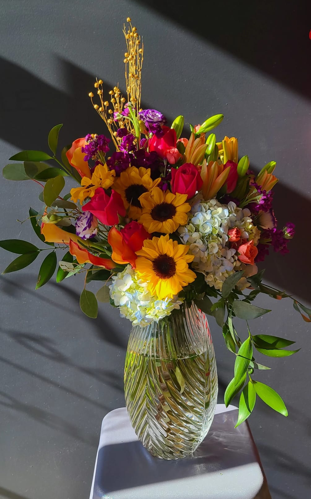 Give the gift of a rainbow with these colorful flowers! lilies, roses