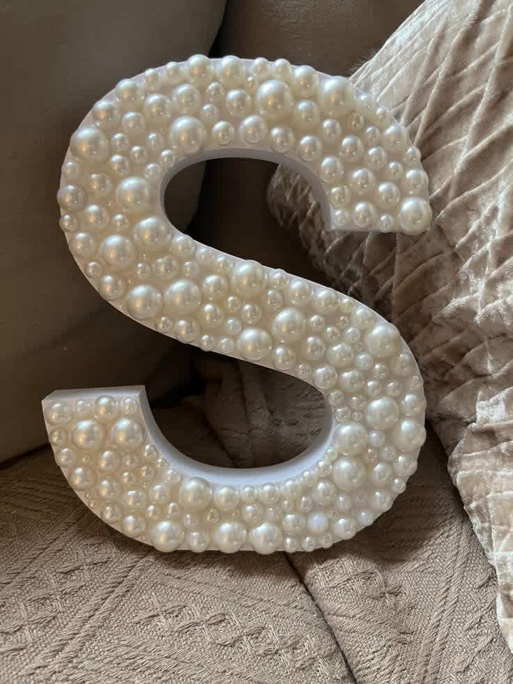 Read the full description
Materials: Acrylic pearls, adhesive, wooden letter
Beautiful wooden letter covered
