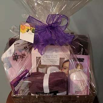 Plush towel set, lotions, facial and foot pampering products and a sweet