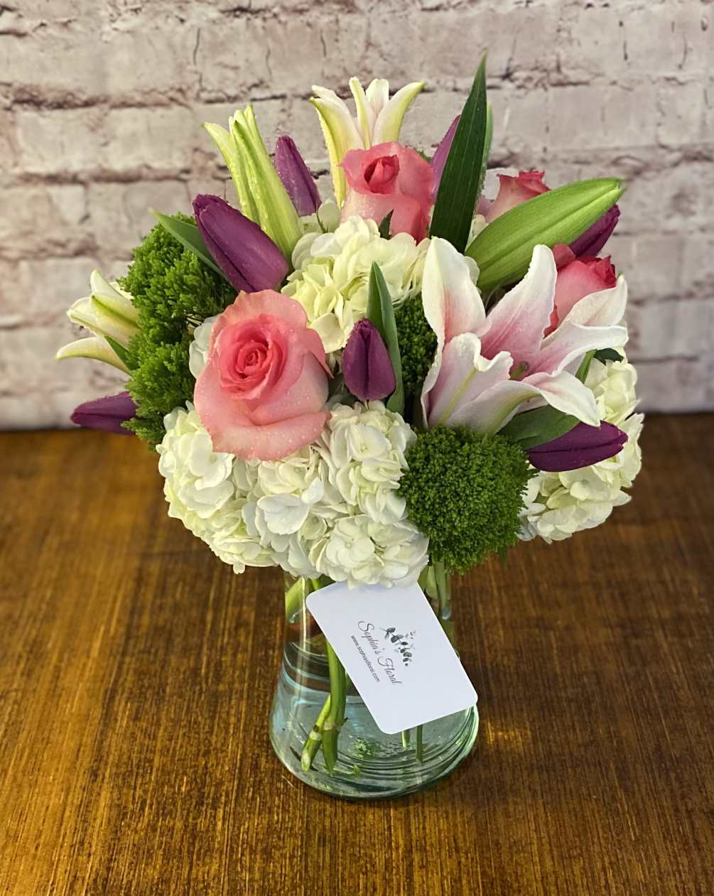 A beautiful assortment of stargazer lilies, hydrangeas, tulips, and roses.
