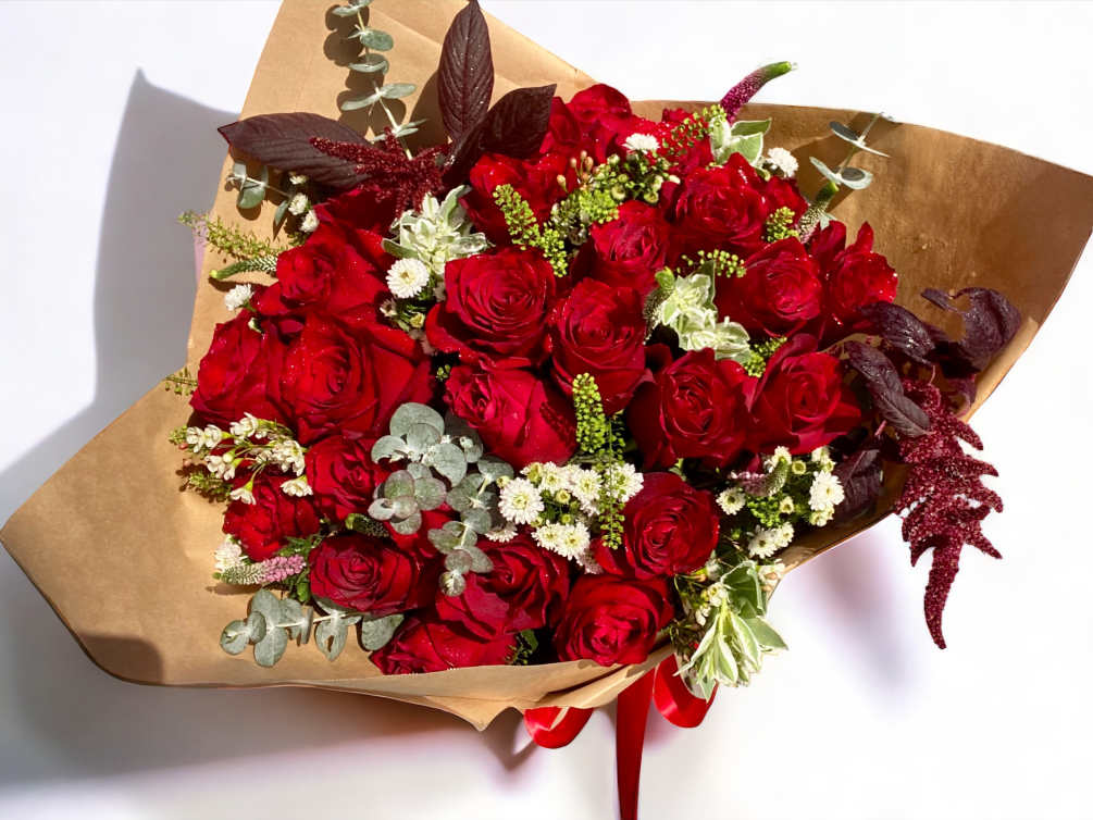 A combination of 24 red roses and greens for a special day.
We