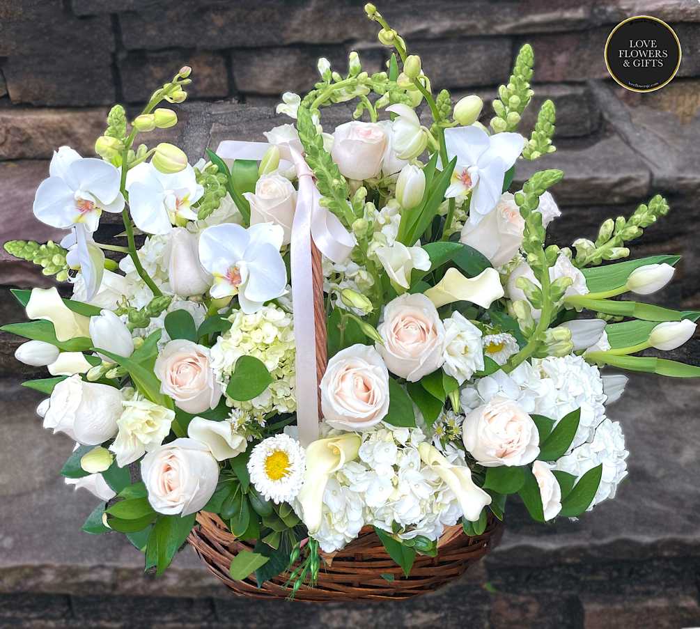 Abundantly elegant blooms of whites made of orchids, calla lilies, tulips, hydrangeas