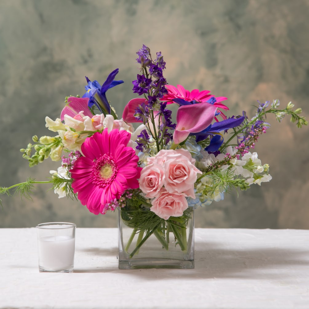 This wild collection of pink flowers is both lush and fun. Spilling