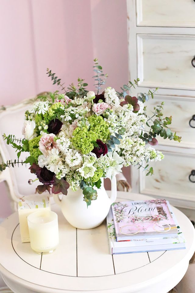 A refreshingly radiant floral arrangement featuring a harmonious blend of seasonal blooms.