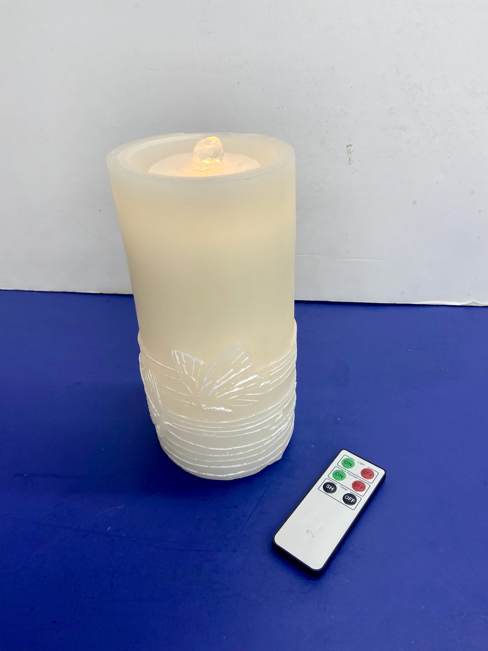 Led wax battery candle fountain with butterflies around the base and water
