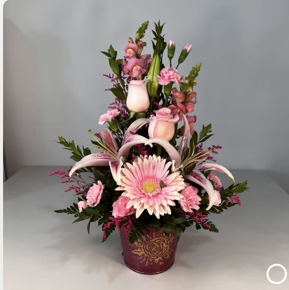 This beautiful arrangement of Pink Snapdragon, Lilies and Roses and Carnations is