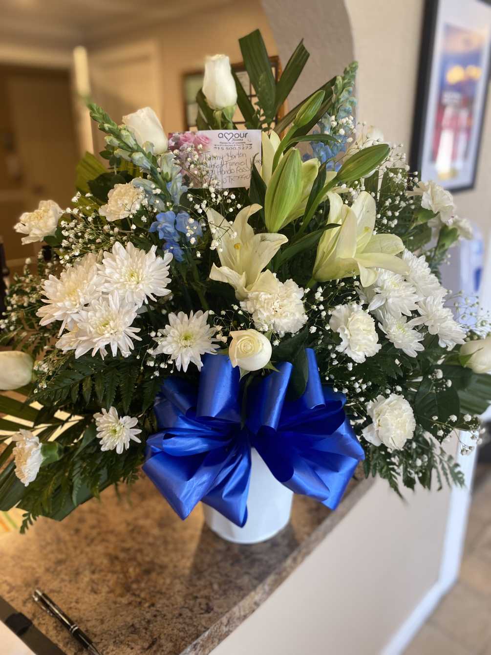 Blue and white sympathy basket by Amour Flowers