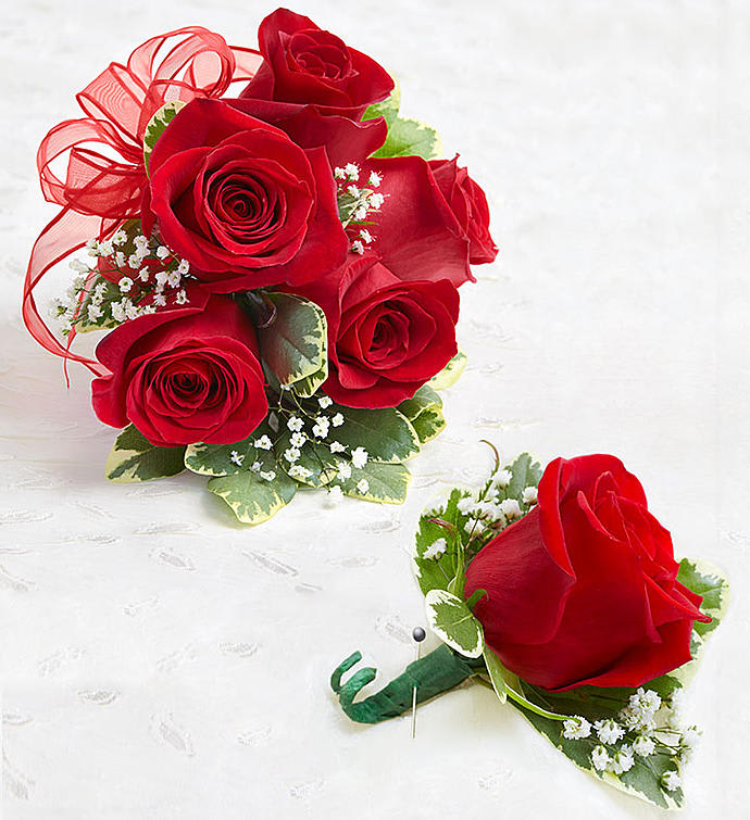 A classic red corsage hand-tied in pink satin that compliments any outfit.