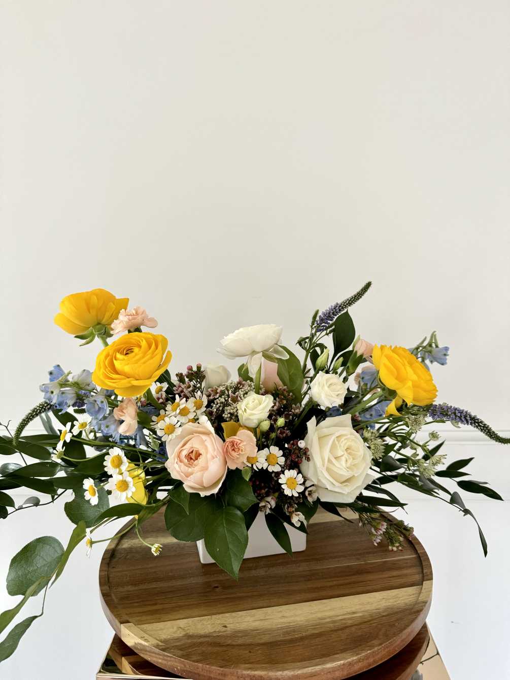 A beautiful and organic arrangement of neutrals with pops of blue and