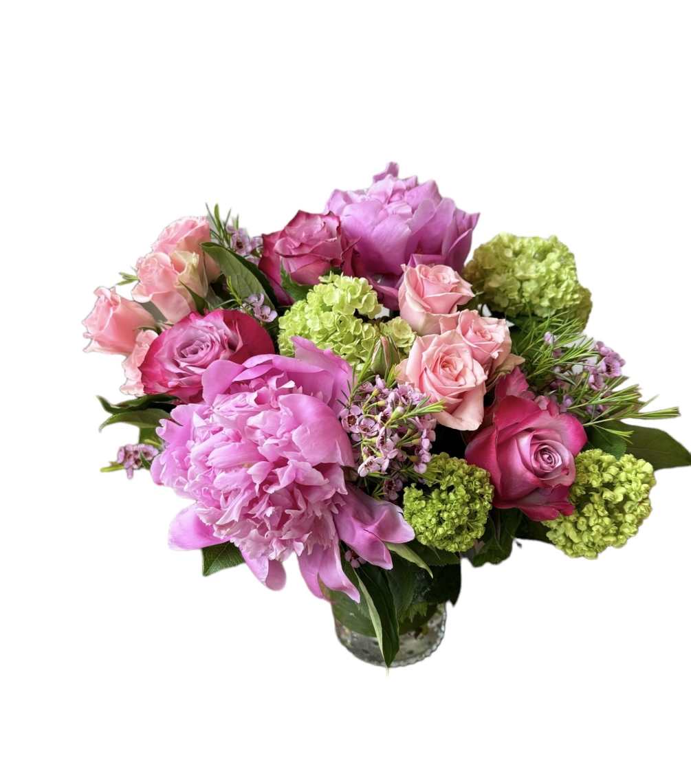 Purple roses, pink peony, pink spray rose, green viburnum and wax flower
