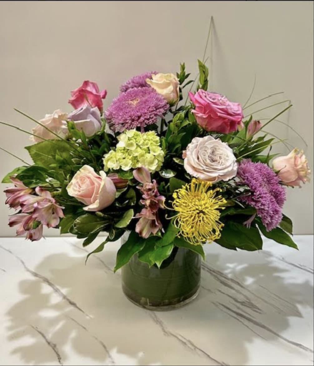 Indulge in the allure of our exquisite floral arrangement, boasting a captivating