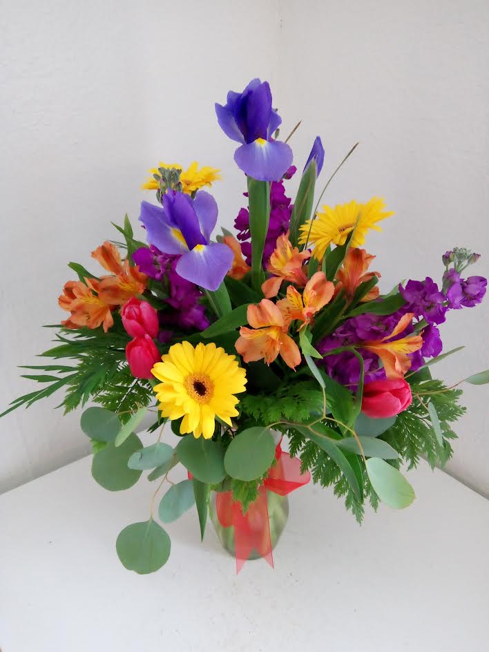 An arrangement of beautiful bright colors that will put a smile on