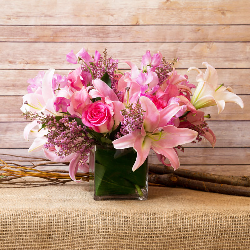 REMINISCE WITH THIS MIX OF PINK SHADES, LILIES, PINK MALIBU ROSES, PINK