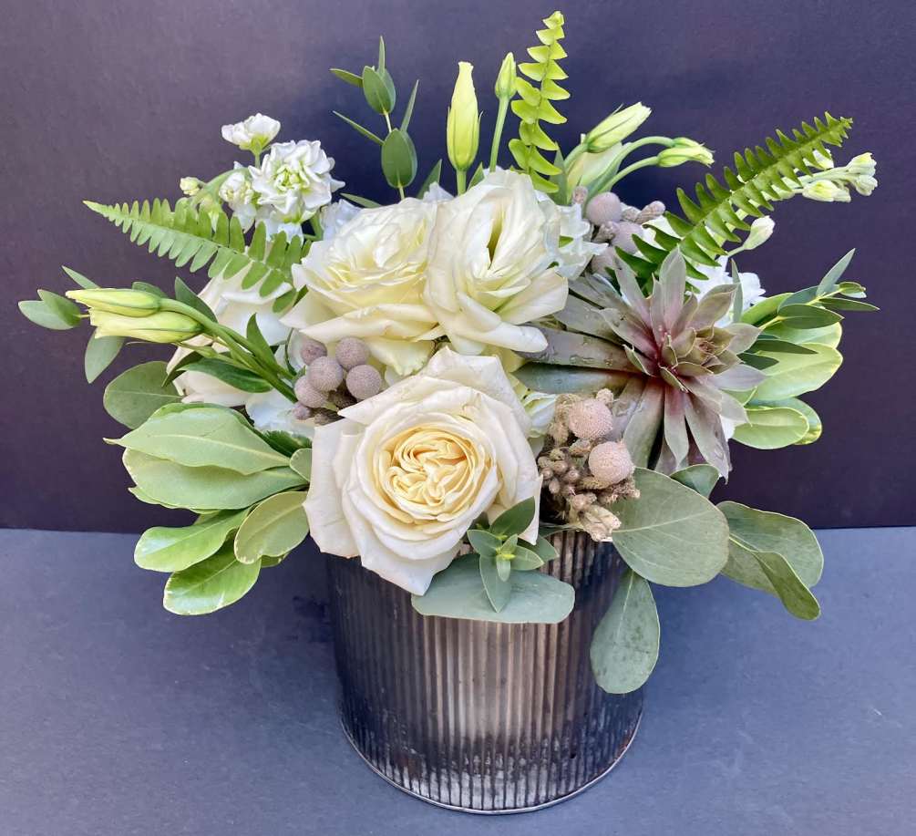 Our large farmhouse style zinc vessel is abundantly filled with fresh hydrangea
