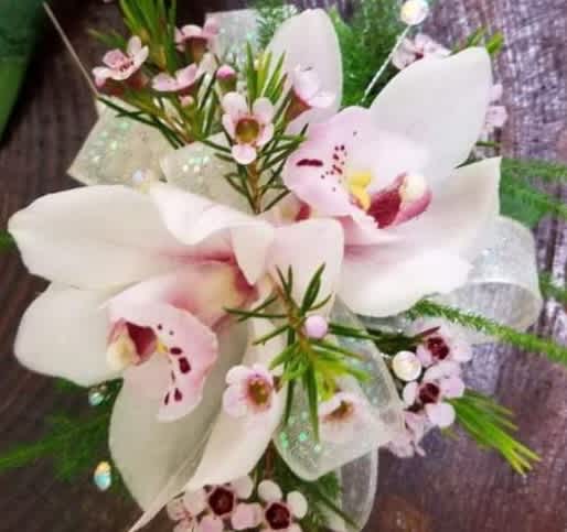  Orchids available in choice of white or pink.
 ALL PROM FLOWERS