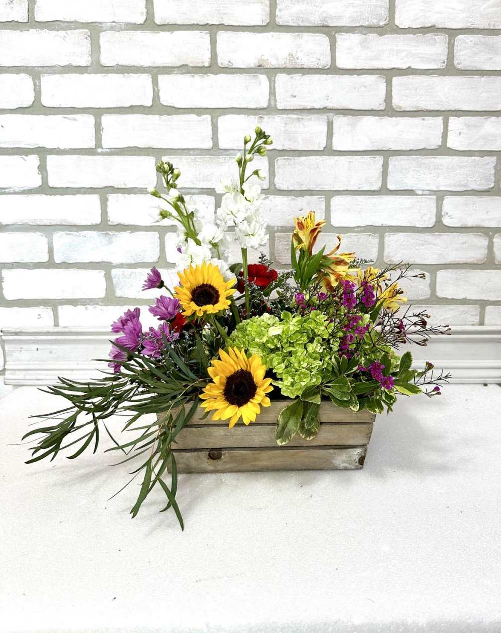 This arrangement is sure to wow them! Includes premium florals - hydrangeas