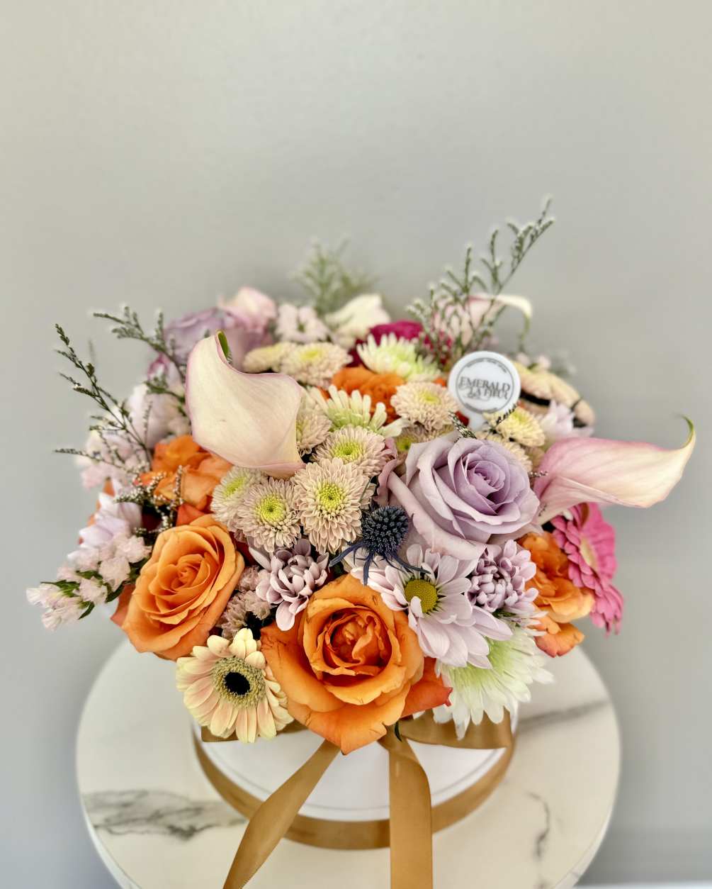 A beautiful mix of colors and flowers specially selected by the Florist.