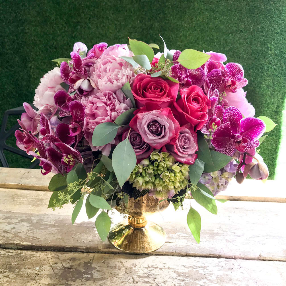 Make your dreams come true with this dreamy arrangement of hot pink/purple