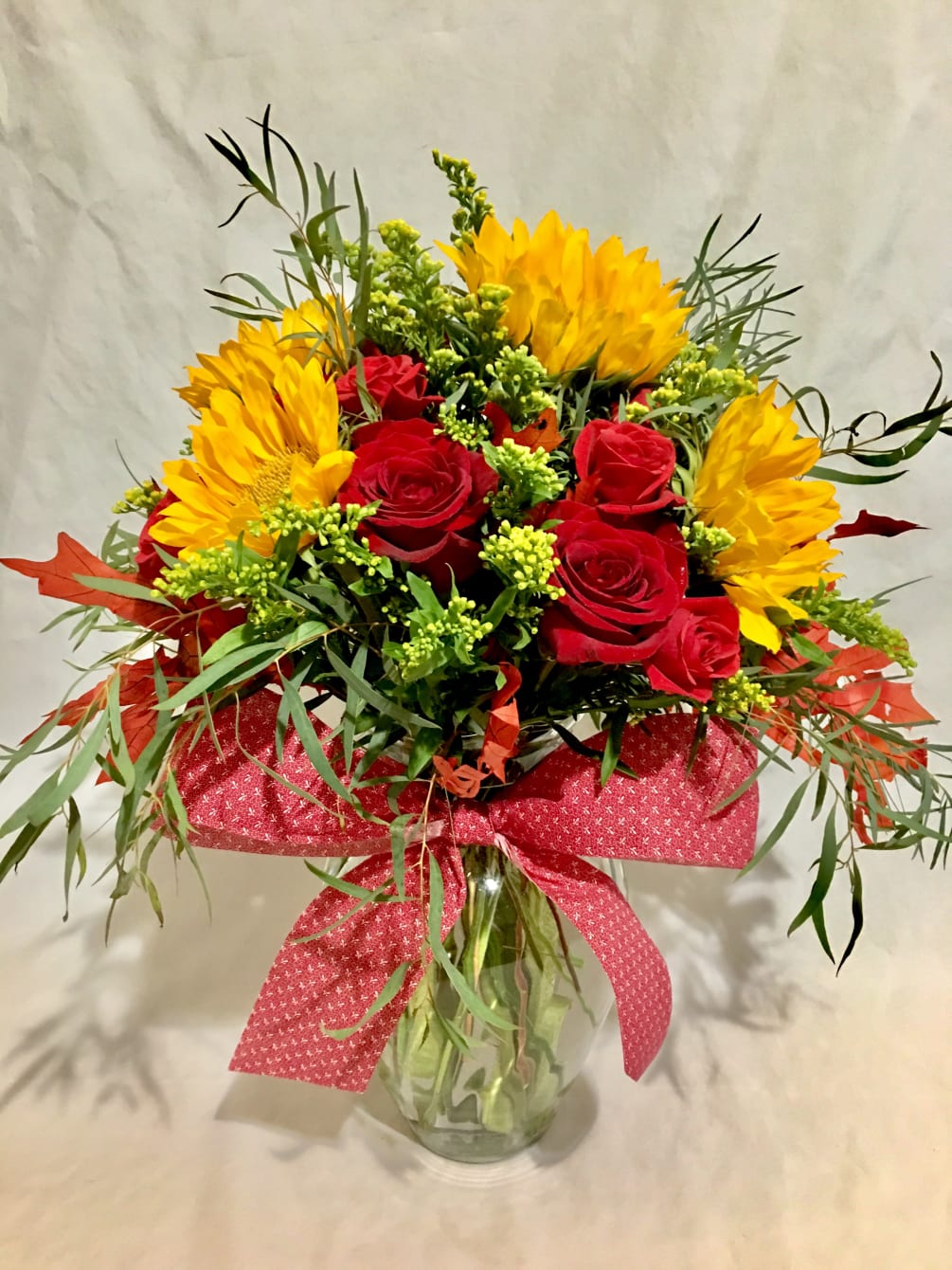 Roses with matching spray roses, Sunflowers with matching Solidago, Preserved Oak Leaves