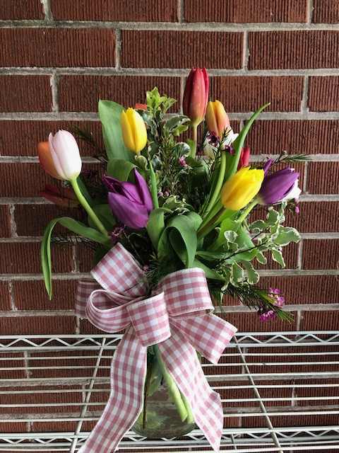 This dainty mixture of 15 tulips are arranged with a variety of