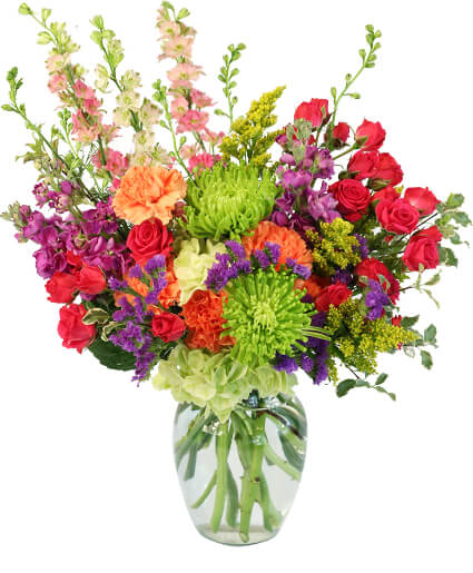 A garden array of bold beautiful blooms in a clear vase. 

Copyrighted