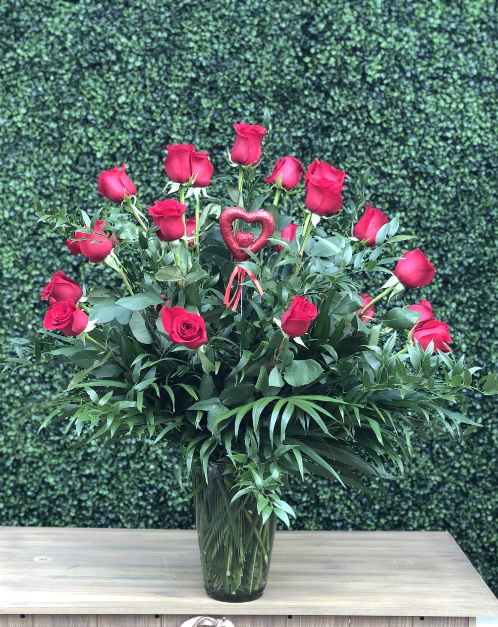 This is Hirni&#039;s Classic Two Dozen Red Roses with greens and filler