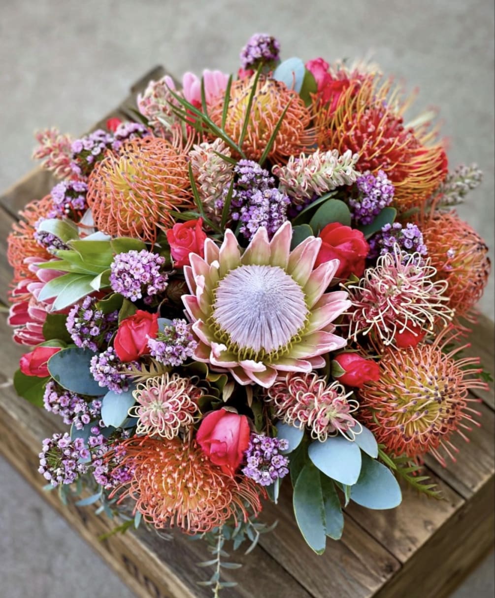 Floral arrangements with protea are not only visually stunning but also symbolize