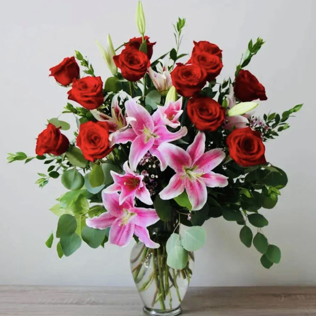 One Dozen Long Stem Red Roses with Pink Stargazer Lilies

Lillies may arrive