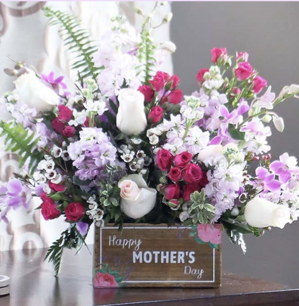 Perfect for mom! Filled with pink roses, lavender stock, dainty wax flower