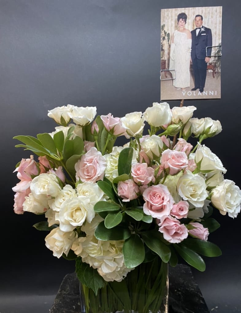 Pretty little bouquet. Hydrangea, spray roses. Pictured in light Pink and White.