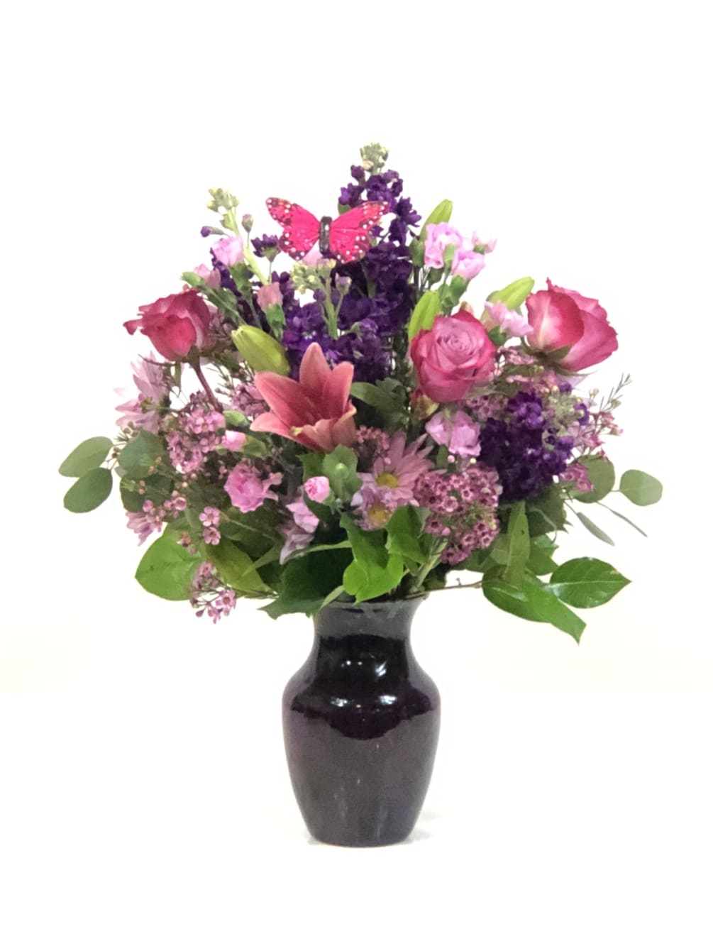 Beautiful assortment of fresh blooms, beautifully designed in hues of purple, pink
