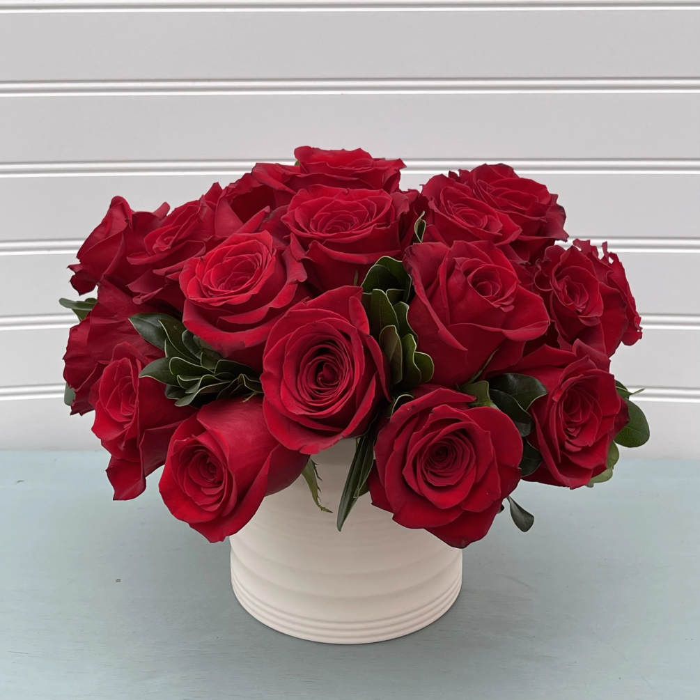A modern take on a rose arrangement. Beautiful large roses are rightly