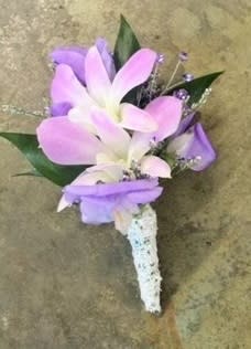 Select this Boutonniere of lavender orchids and pale purple sweet peas accented