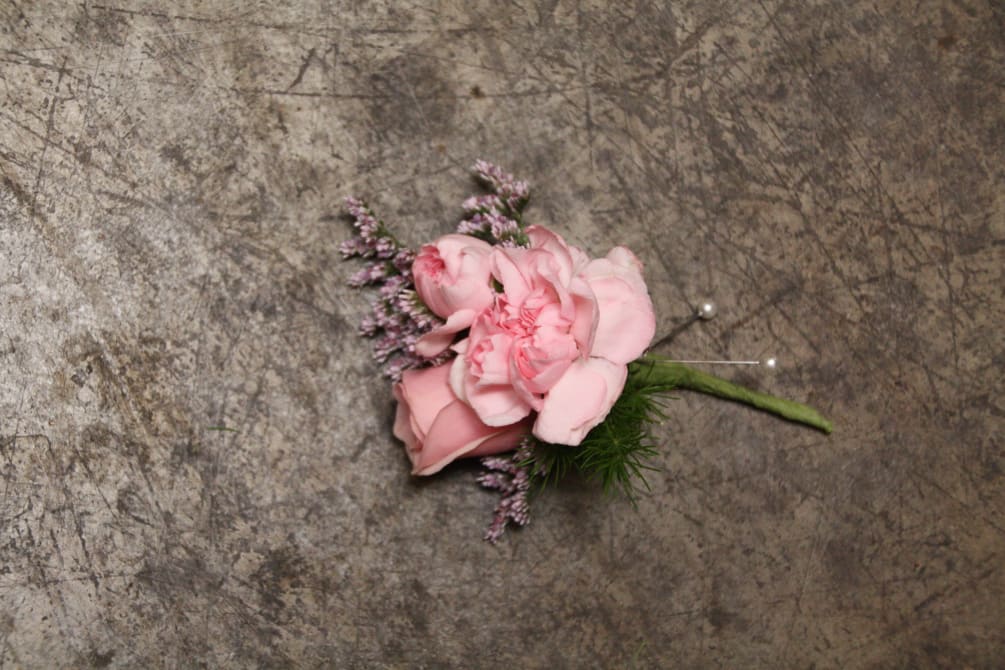 Select this boutonniere of pink mini carnations and a single pink spray