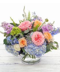 lavender stock blue delphiniums  spray roses and veronica