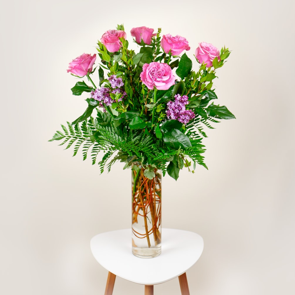 This elegant arrangement features 6 stems of our captivating garden-like rose with