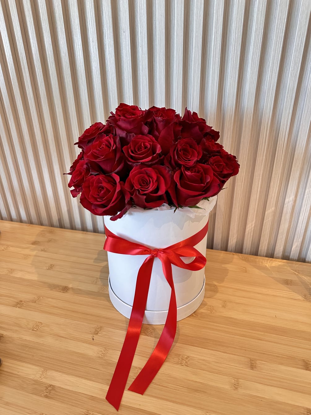 White box with red roses.