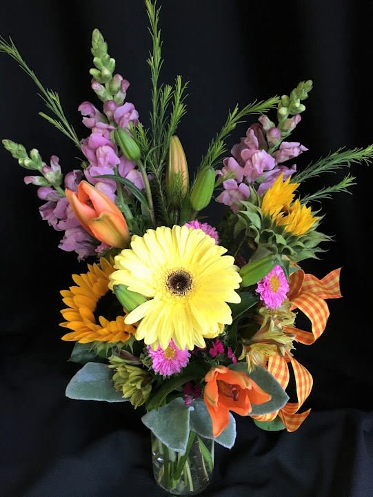 Smallish bouquet of summer&#039;s best flowers.  Combination and color will vary.
