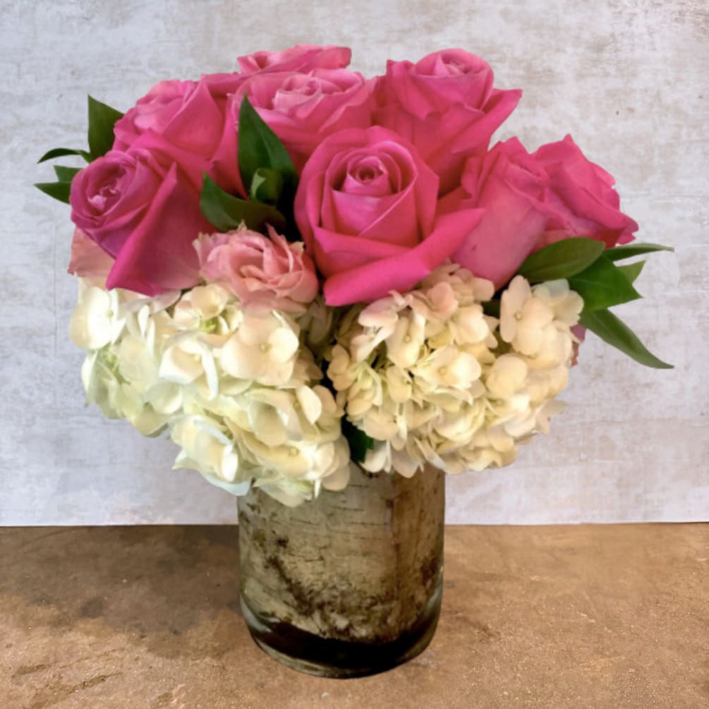 A stunning showcase of vibrant pink roses and soft pink lisianthus contrasted