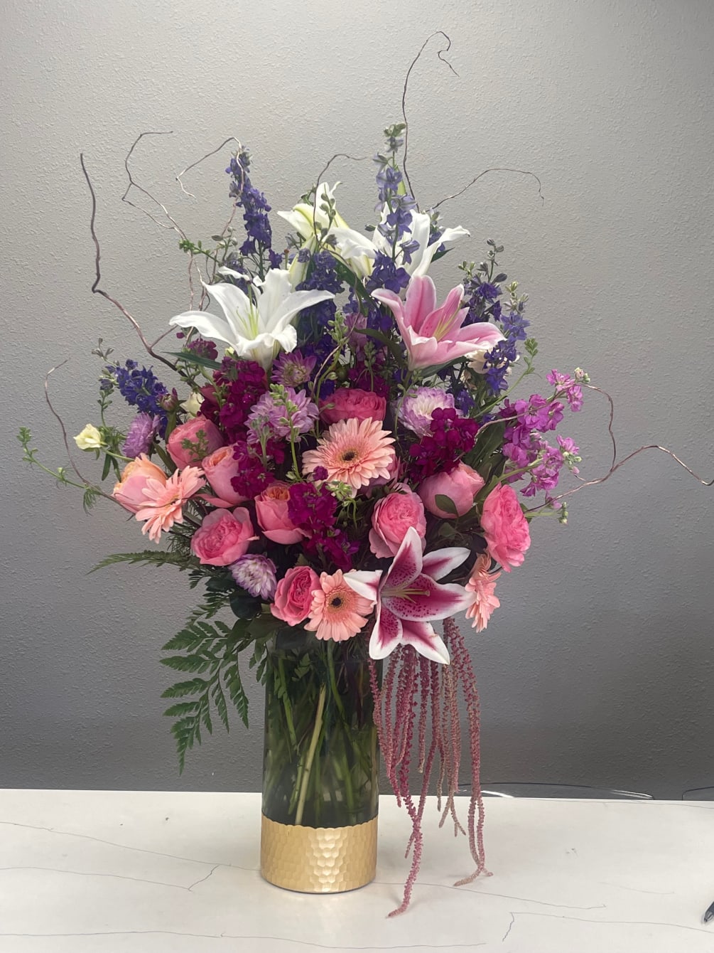 A FABULOUS COLLECTION OF PINK, LAVENDER, PURPLE FLOWERS MAKE THIS BOUQUET A