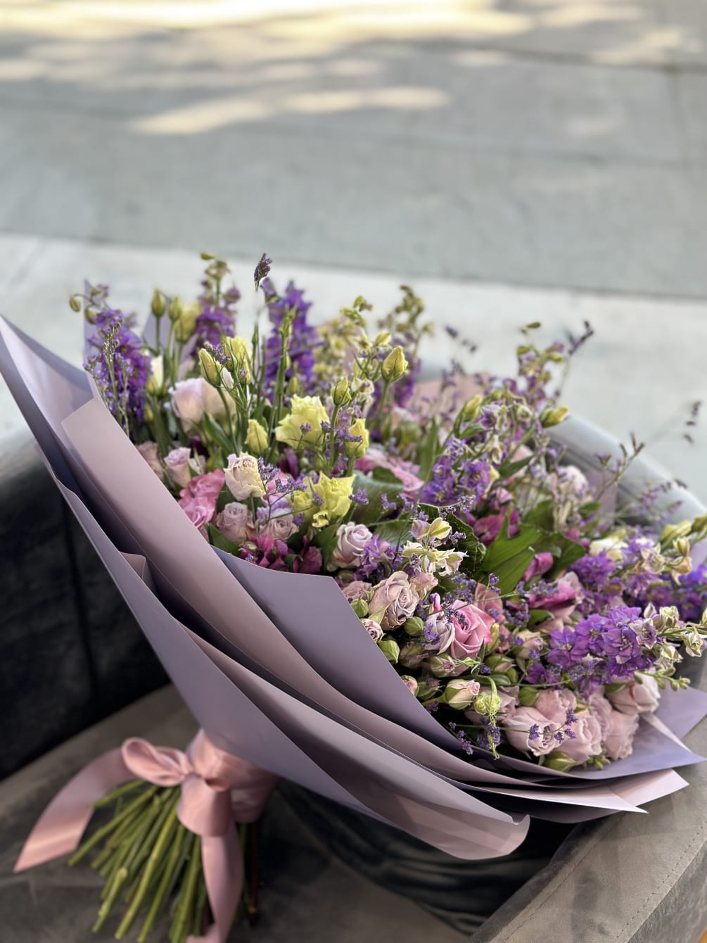 A beautiful and colorful bouquet with a variety of premium purple flowers
