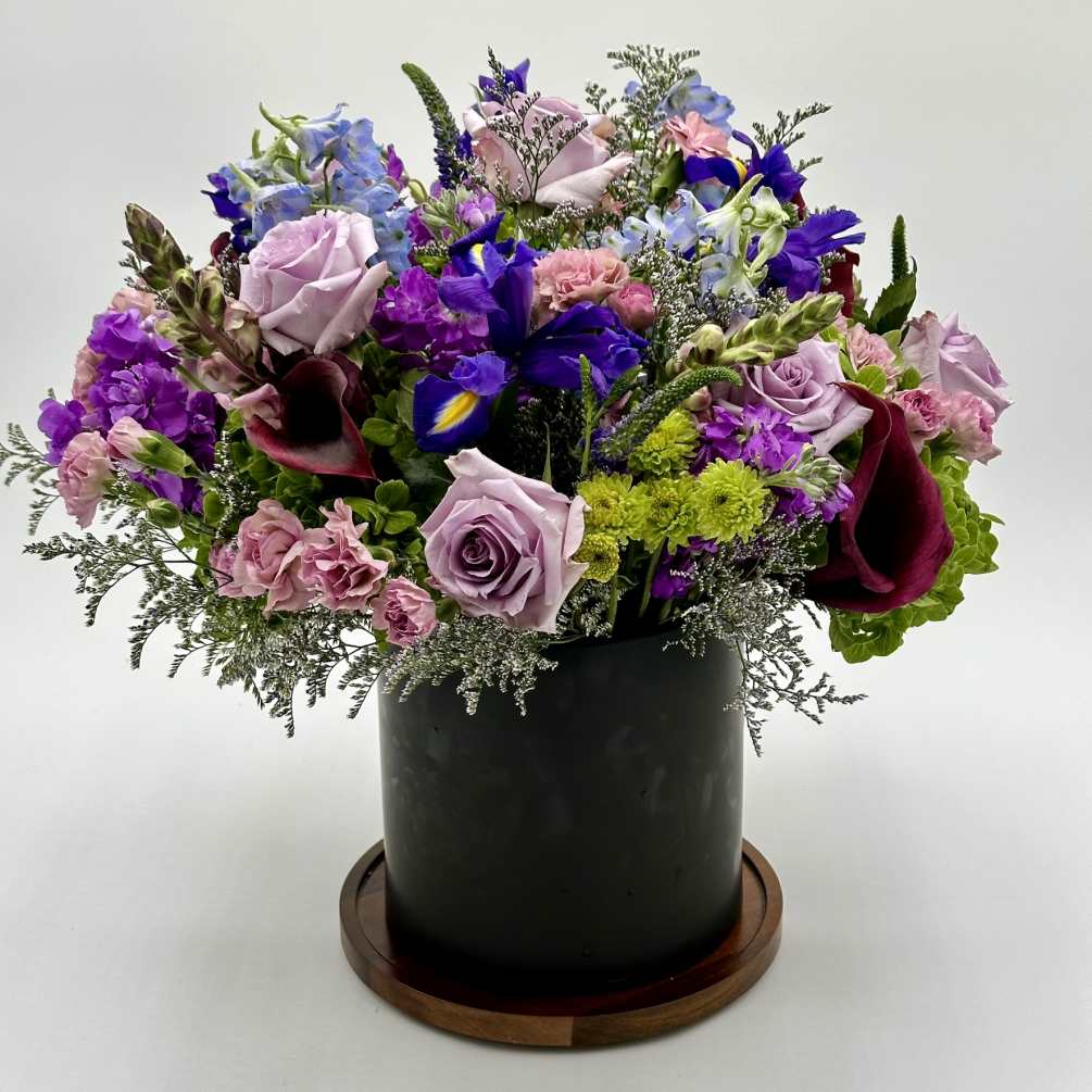 A beautiful purple and lavender flower arrangement would likely feature a stunning