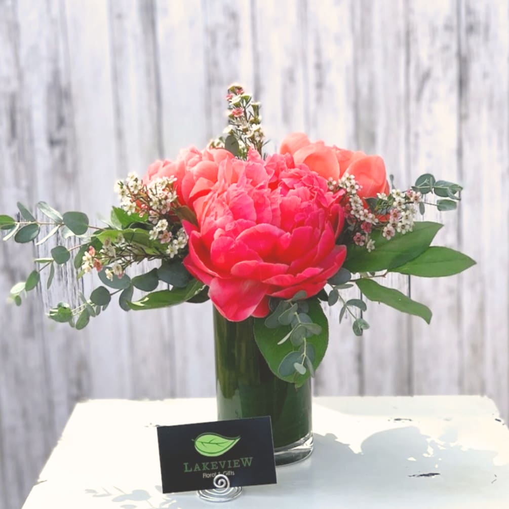 Tell someone they&#039;re incredible with vibrant coral peonies in a petite glass