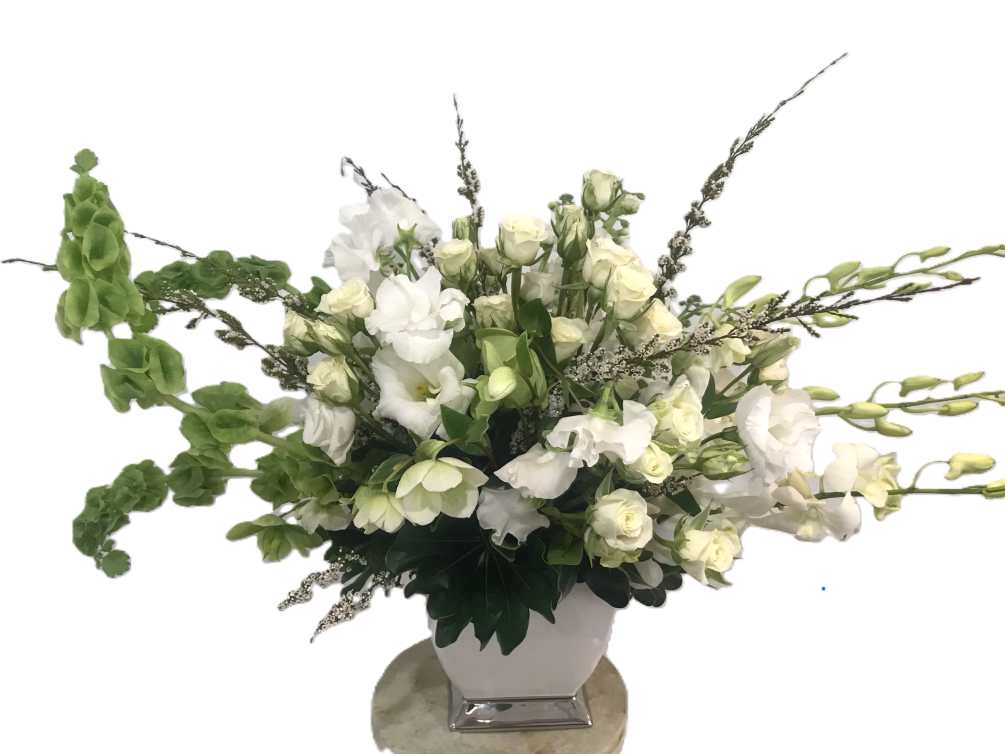 Elegantly assembled lisianthus, spray roses, stock, orchids, belles of Ireland, and other