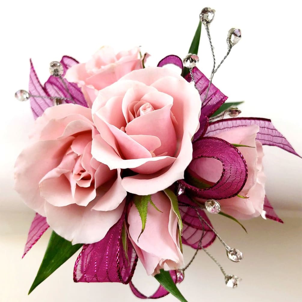 Wrist corsage for proms, dances and more! Light pink spray roses with