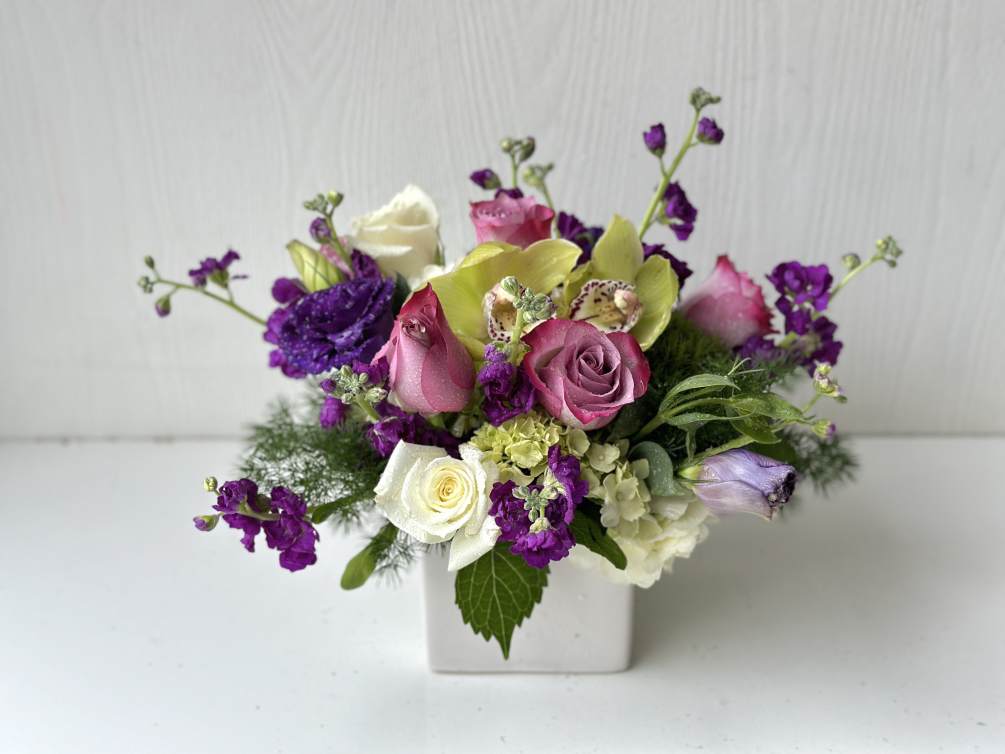 The Lavender Dreams flower arrangement is crafted to captivate and enchant. This