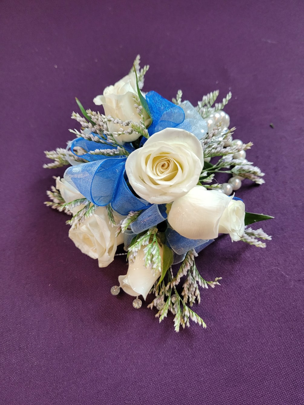  Beautiful prom corsage.  Please call to discuss the colors of